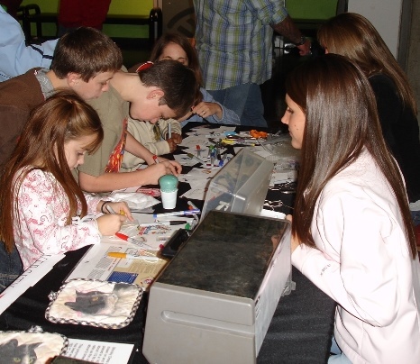 Several youngsters involved in chemistry activities.