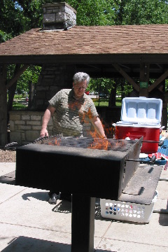 Keith Stine gets grill going