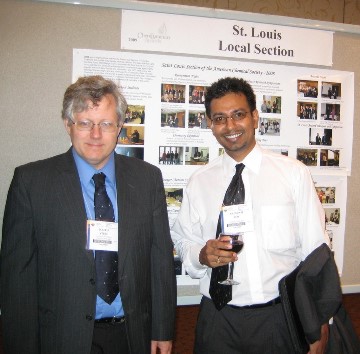 Stine and Roy with section activities poster