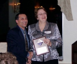 Leah O&rsquo;Brien and Bijan Khazai proudly display the plaque from the national ACS