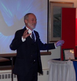 Photo of Greg Wall accepting the Distinguished Service Award