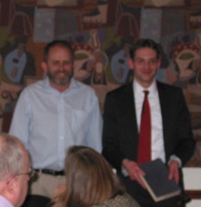 Jeff Cornelius passes the book (and gavel) to Eric Bruton