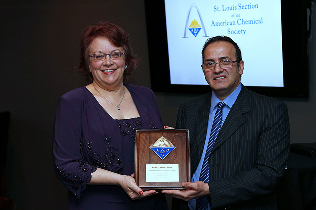Leah O'Brien receives Distinguished Service Award from Ziad Ramadan