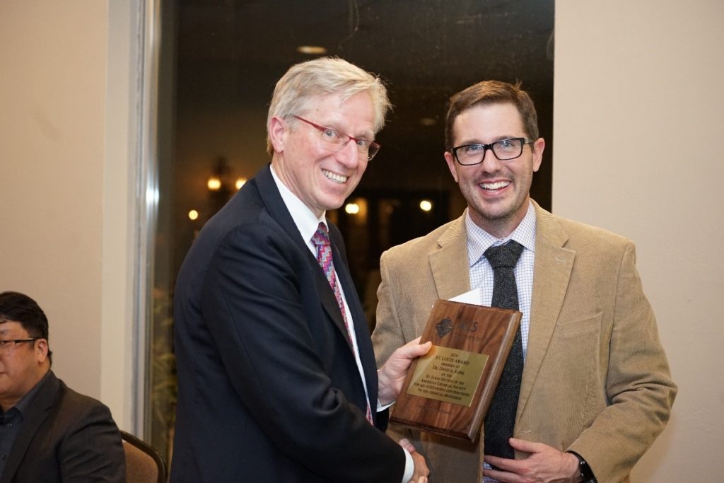 David Keire receiving the St. Louis Section ACS Award at the Banquet from Benjamin Barth, immediate past chair of the section.