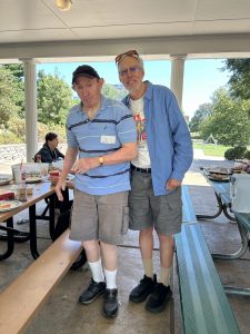 Two People posing in a park pavilion